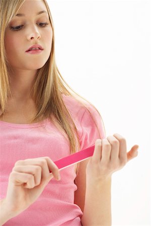 simsearch:600-00866185,k - Girl Filing Nails Stock Photo - Premium Royalty-Free, Code: 600-00866224