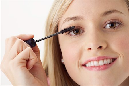 simsearch:600-00866185,k - Girl Applying Make-Up Stock Photo - Premium Royalty-Free, Code: 600-00866231