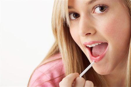 preteen girl mouth - Girl Applying Make-Up Stock Photo - Premium Royalty-Free, Code: 600-00866233