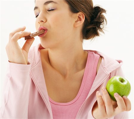 simsearch:600-00866185,k - Girl with Apple and Chocolate Stock Photo - Premium Royalty-Free, Code: 600-00866256