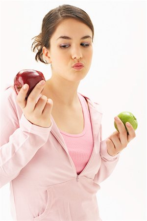 simsearch:600-00866185,k - Girl Holding Apples Stock Photo - Premium Royalty-Free, Code: 600-00866252