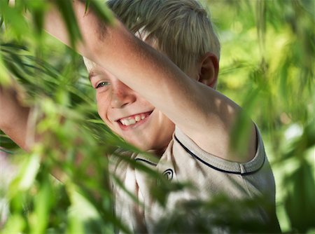 Portrait of Boy in Foliage Stock Photo - Premium Royalty-Free, Code: 600-00866541