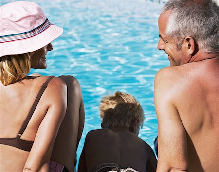simsearch:600-00934216,k - Family by Swimming Pool Stock Photo - Premium Royalty-Free, Code: 600-00866648