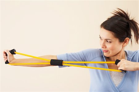 stretching (extended object) - Woman Exercising Stock Photo - Premium Royalty-Free, Code: 600-00866862