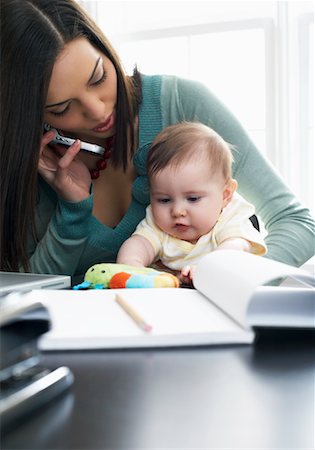 simsearch:700-01827614,k - Mother Talking on Cellular Phone With Baby on Her Lap Foto de stock - Sin royalties Premium, Código: 600-00909561