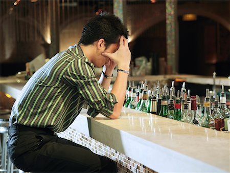 Man Sitting at Bar Stock Photo - Premium Royalty-Free, Code: 600-00909849