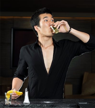 simsearch:700-00530291,k - Man Drinking Shot at Bar Stock Photo - Premium Royalty-Free, Code: 600-00909913