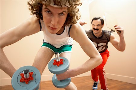 simsearch:600-00955031,k - Man Lifting Weights, Personal Trainer in the Background Stock Photo - Premium Royalty-Free, Code: 600-00917044