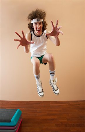 Man Jumping, Reaching Toward Camera Stock Photo - Premium Royalty-Free, Code: 600-00917042