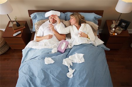 flu season - Sick Couple in Bed Stock Photo - Premium Royalty-Free, Code: 600-00917354