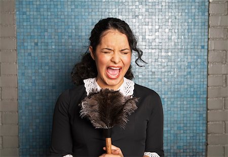 Maid Holding Duster and Screaming Stock Photo - Premium Royalty-Free, Code: 600-00917492