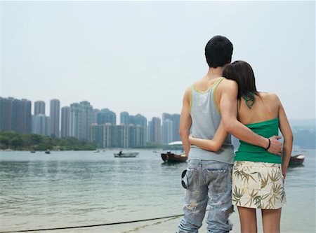 simsearch:600-00910373,k - Couple Looking at Skyline Stock Photo - Premium Royalty-Free, Code: 600-00910371