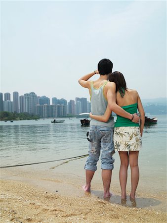 simsearch:600-00910373,k - Couple Looking at Skyline Stock Photo - Premium Royalty-Free, Code: 600-00910372