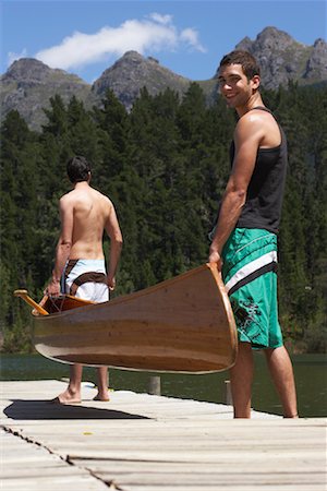 Friends Carrying Canoe Stock Photo - Premium Royalty-Free, Code: 600-00911916