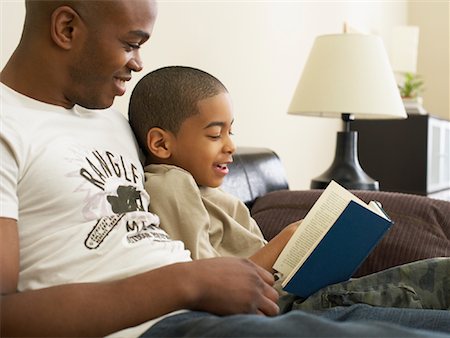 Father and Son Reading Stock Photo - Premium Royalty-Free, Code: 600-00934292