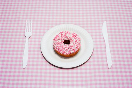 Place Setting with Doughnut Stock Photo - Premium Royalty-Free, Code: 600-00933881