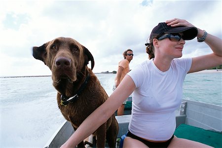 Couple Boating With Dog, Cayman Islands Stock Photo - Premium Royalty-Free, Code: 600-00933915