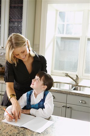 simsearch:700-00551400,k - Mother Helping Daughter with Homework Stock Photo - Premium Royalty-Free, Code: 600-00947952