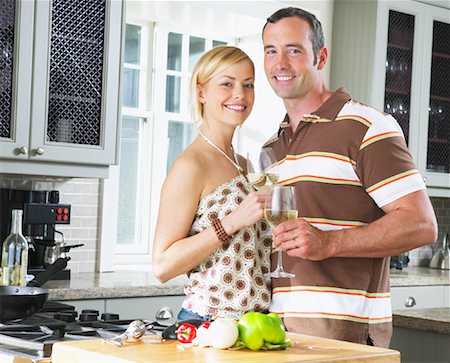 simsearch:400-05740111,k - Portrait of Couple in Kitchen Stock Photo - Premium Royalty-Free, Code: 600-00947985