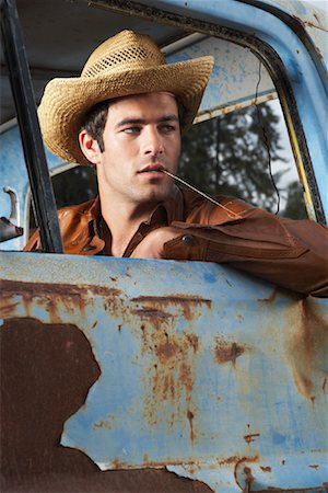 Man In Cowboy Hat and Rusty Truck Stock Photo - Premium Royalty-Free, Code: 600-00948089
