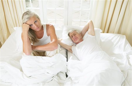 simsearch:600-00948533,k - Mature Couple In Bed Stock Photo - Premium Royalty-Free, Code: 600-00948532