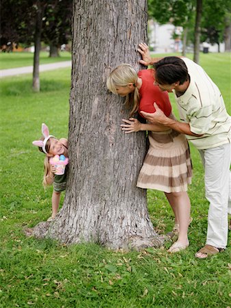 easter in canada - Family in Park, Easter Egg Hunt Stock Photo - Premium Royalty-Free, Code: 600-00948606