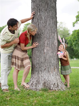 easter in canada - Family in Park, Easter Egg Hunt Stock Photo - Premium Royalty-Free, Code: 600-00948607