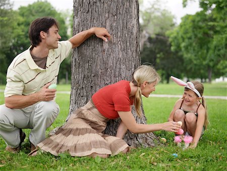 easter in canada - Family in Park, Easter Egg Hunt Stock Photo - Premium Royalty-Free, Code: 600-00948609