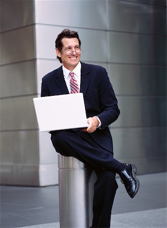 simsearch:700-00281308,k - Businessman with Laptop Outdoors Stock Photo - Premium Royalty-Free, Code: 600-00948909