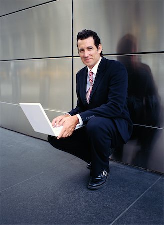 simsearch:700-00281308,k - Businessman with Laptop Outdoors Stock Photo - Premium Royalty-Free, Code: 600-00948910