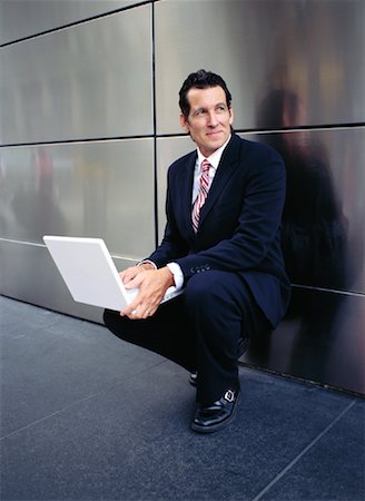 simsearch:700-00281308,k - Businessman with Laptop Outdoors Stock Photo - Premium Royalty-Free, Code: 600-00948911