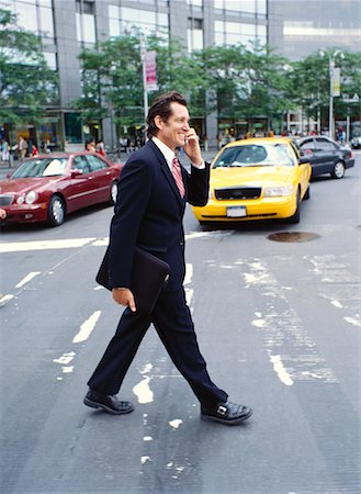 simsearch:700-00281308,k - Businessman with Cellular Phone Crossing Street Stock Photo - Premium Royalty-Free, Code: 600-00948926