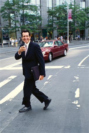 simsearch:700-00281308,k - Businessman with Cellular Phone Crossing Street Stock Photo - Premium Royalty-Free, Code: 600-00948927
