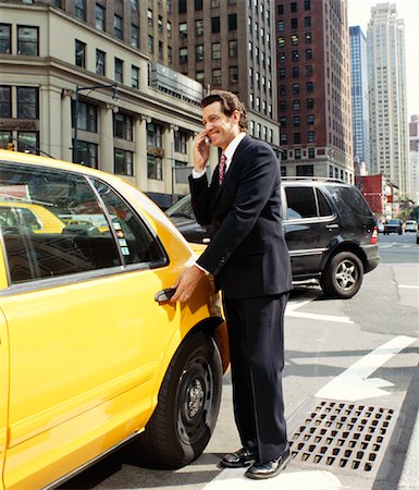 simsearch:700-00695760,k - Businessman Getting into Taxi Stock Photo - Premium Royalty-Free, Code: 600-00948938