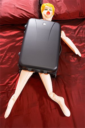 funny luggage - Blow-Up Doll in Suitcase Stock Photo - Premium Royalty-Free, Code: 600-00954706