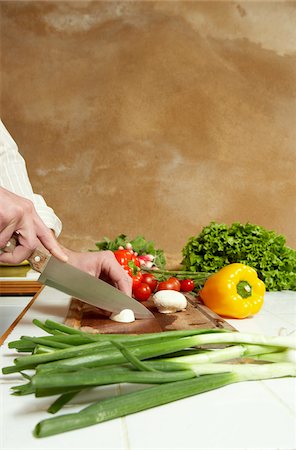 Man Chopping Vegetables Stock Photo - Premium Royalty-Free, Code: 600-00954740