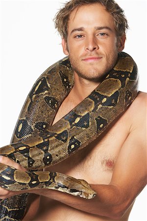 Portrait of Man with Boa Constrictor Stock Photo - Premium Royalty-Free, Code: 600-00984431