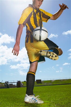 Man Playing Soccer Stock Photo - Premium Royalty-Free, Code: 600-00983957