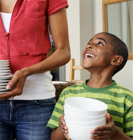 Mother and Son Holding Dishes Stock Photo - Premium Royalty-Free, Code: 600-01014873