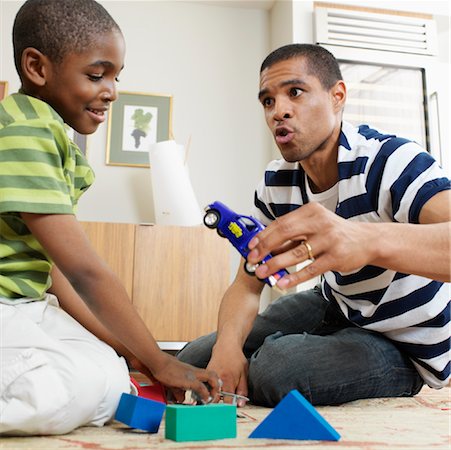 simsearch:700-01295913,k - Father and Son Playing with Toys Stock Photo - Premium Royalty-Free, Code: 600-01014904