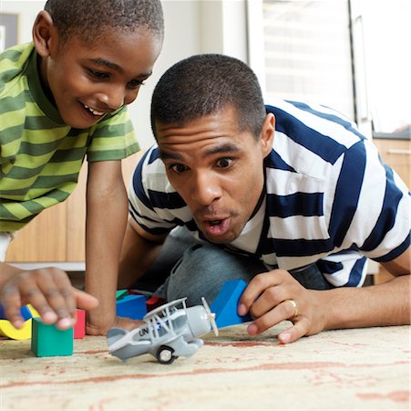 simsearch:700-01295913,k - Father and Son Playing with Toys Stock Photo - Premium Royalty-Free, Code: 600-01014903