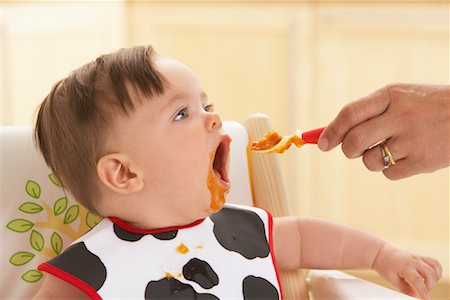 simsearch:700-02586125,k - Baby being Fed Stock Photo - Premium Royalty-Free, Code: 600-01015420