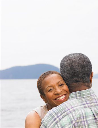 simsearch:600-02346335,k - Couple Hugging by Water Stock Photo - Premium Royalty-Free, Code: 600-01036960