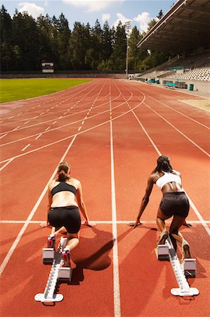 ready, set, go - Women Poised on Racetrack Stock Photo - Premium Royalty-Free, Code: 600-01037049