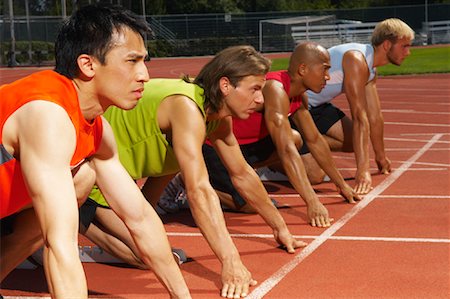 simsearch:700-01837311,k - Men Lined up at Starting Blocks Stock Photo - Premium Royalty-Free, Code: 600-01037067