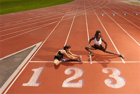 Women Stretching on Track Stock Photo - Premium Royalty-Free, Code: 600-01037087