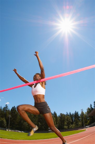 people running a race. Woman Winning Running Race