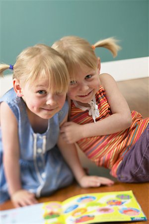 simsearch:700-00150473,k - Twin Sisters Reading Book Stock Photo - Premium Royalty-Free, Code: 600-01037661