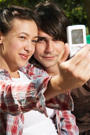 simsearch:600-01072271,k - Couple Taking Photo with Camera Phone Stock Photo - Premium Royalty-Free, Code: 600-01030365