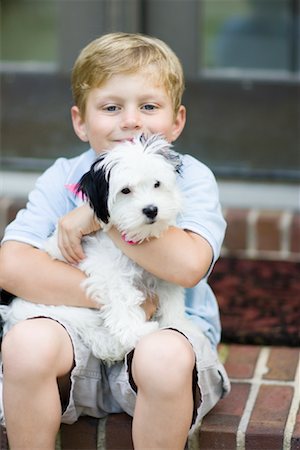 simsearch:700-00071488,k - Portrait of Boy Holding Dog Stock Photo - Premium Royalty-Free, Code: 600-01041387